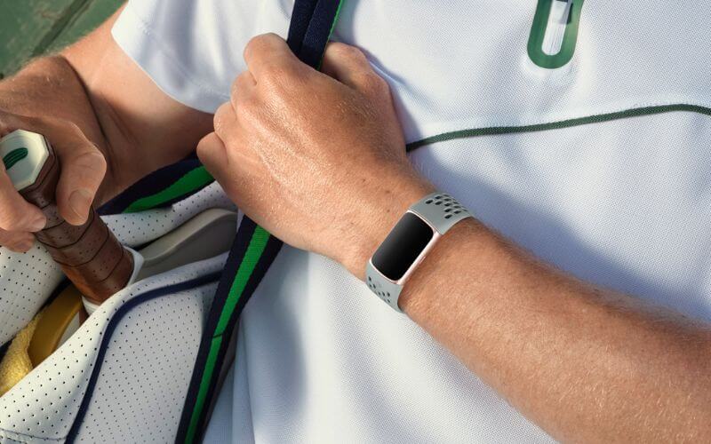 A man wearing a rugged Fitbit Charge 6 during a workout.